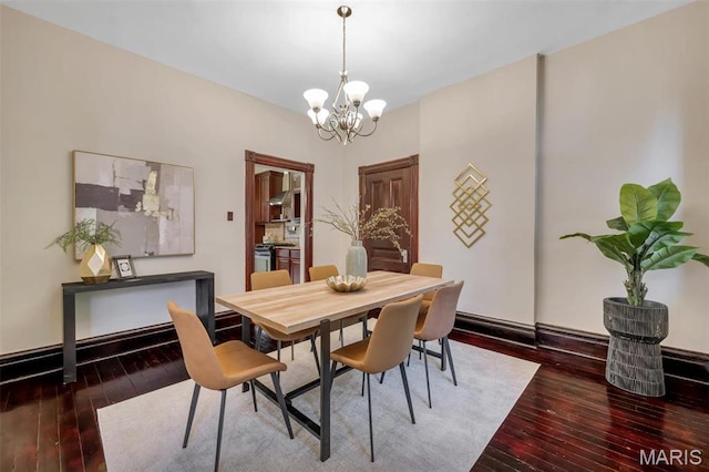 2811 Pennsylvania Ave, Saint Louis, MO 63118 - dining room featuring a chandelier and hardwood / wood-style floors
