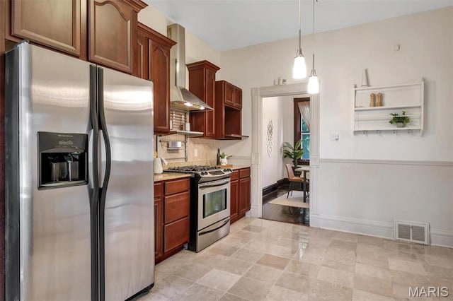 2811 Pennsylvania Ave, Saint Louis, MO 63118 - kitchen with appliances with stainless steel finishes, light countertops, wall chimney exhaust hood, decorative backsplash, and baseboards