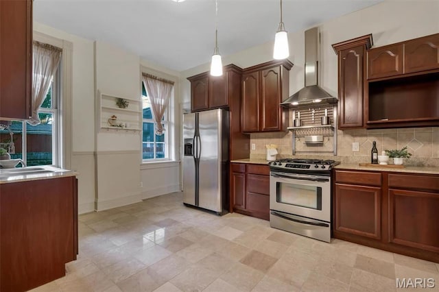 2811 Pennsylvania Ave, Saint Louis, MO 63118 - kitchen with stainless steel appliances, wall chimney exhaust hood, backsplash, pendant lighting, and a sink