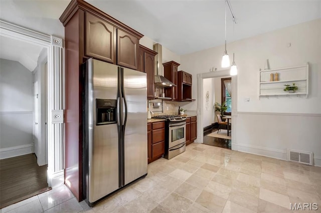 2811 Pennsylvania Ave, Saint Louis, MO 63118 - kitchen featuring stainless steel appliances, light countertops, baseboards, pendant lighting, and wall chimney range hood