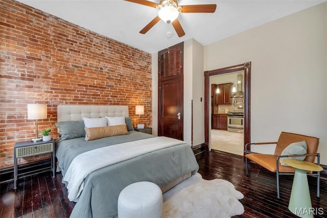 2811 Pennsylvania Ave, Saint Louis, MO 63118 - bedroom featuring brick wall, dark wood-style flooring, ensuite bathroom, and a ceiling fan