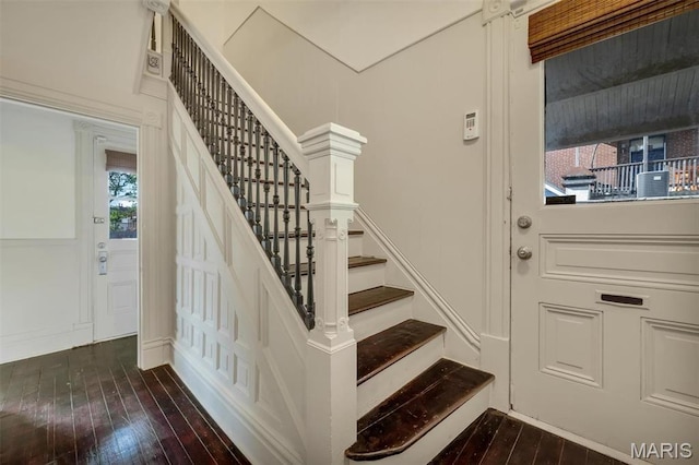 2811 Pennsylvania Ave, Saint Louis, MO 63118 - stairs featuring hardwood / wood-style flooring