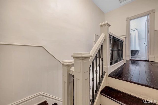 2811 Pennsylvania Ave, Saint Louis, MO 63118 - staircase featuring a decorative wall and wood finished floors