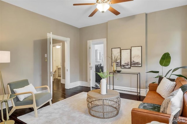 2811 Pennsylvania Ave, Saint Louis, MO 63118 - living room with ceiling fan, baseboards, and dark wood finished floors