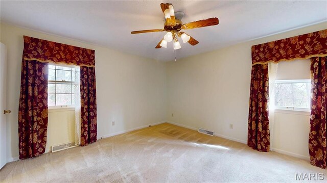 1402 Liberty Dr, Rolla, MO 65401 - spare room with carpet flooring, a ceiling fan, and baseboards