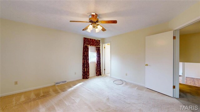 1402 Liberty Dr, Rolla, MO 65401 - carpeted empty room featuring a ceiling fan and baseboards