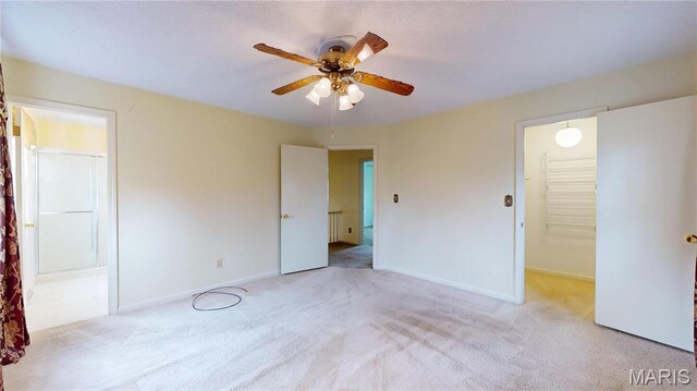 1402 Liberty Dr, Rolla, MO 65401 - unfurnished bedroom featuring carpet, baseboards, and a ceiling fan