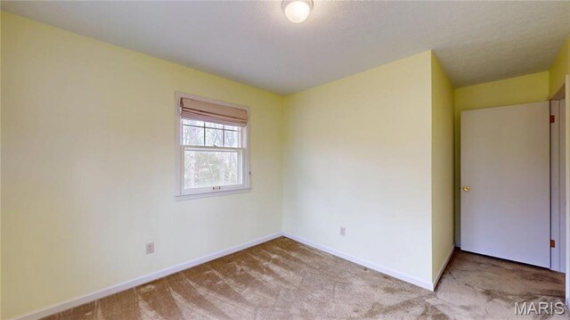 1402 Liberty Dr, Rolla, MO 65401 - carpeted spare room with baseboards
