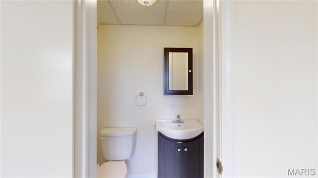 1402 Liberty Dr, Rolla, MO 65401 - bathroom with toilet, vanity, and a drop ceiling