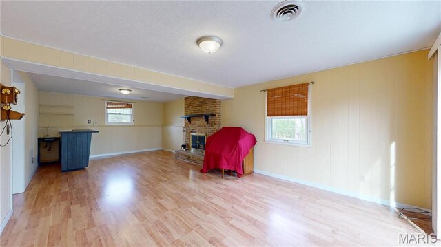 1402 Liberty Dr, Rolla, MO 65401 - living room featuring a fireplace, wood finished floors, and baseboards