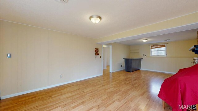 1402 Liberty Dr, Rolla, MO 65401 - unfurnished bedroom with wood finished floors and baseboards