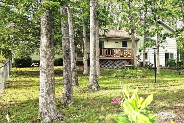 1402 Liberty Dr, Rolla, MO 65401 - view of yard featuring a deck