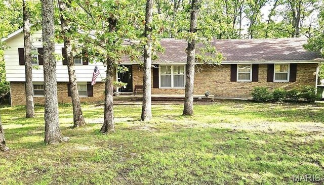 1402 Liberty Dr, Rolla, MO 65401 - split level home with brick siding and a front yard
