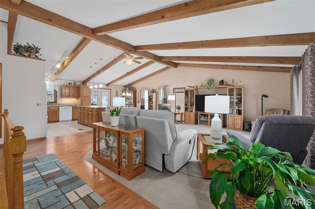 living room with light wood-style flooring, ceiling fan, and a chandelier