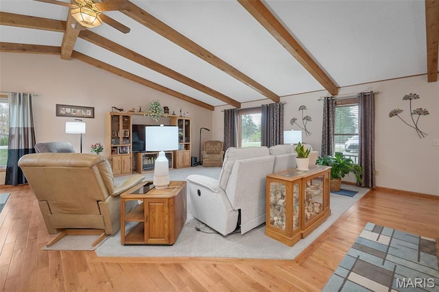living area with a ceiling fan, light wood finished floors, and baseboards