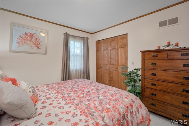 bedroom with ornamental molding and a closet