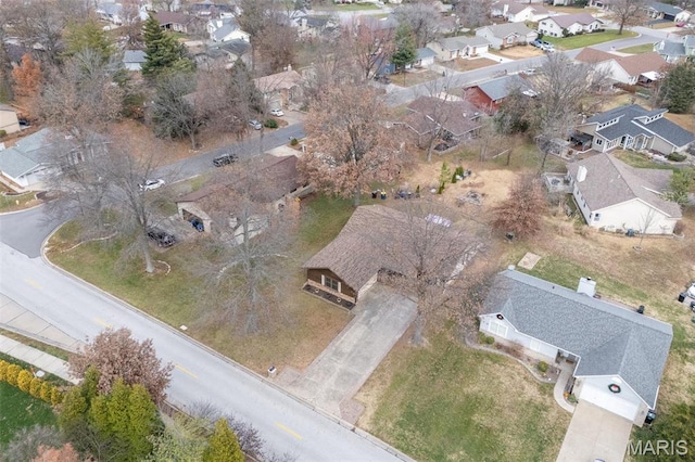 aerial view of property and surrounding area featuring nearby suburban area