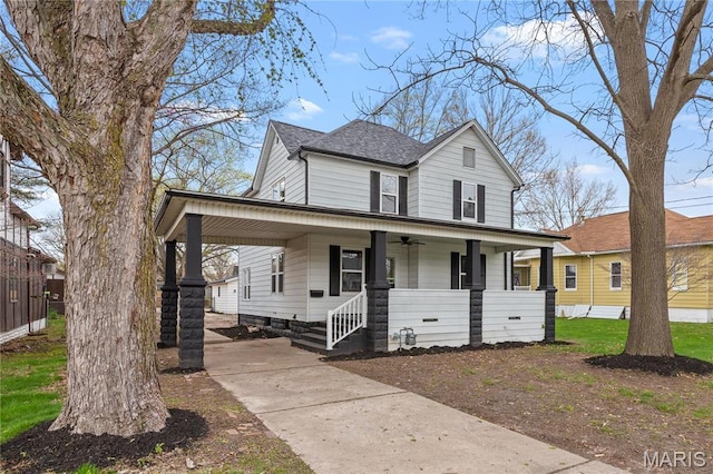 view of front facade featuring a porch, roof with shingles, ceiling fan, and driveway