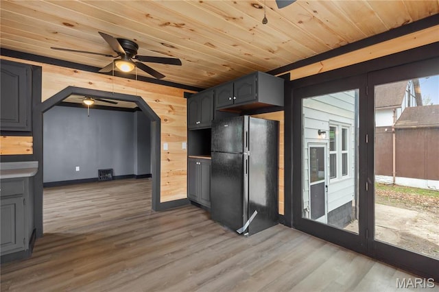 kitchen featuring freestanding refrigerator, a ceiling fan, wood ceiling, wood finished floors, and gray cabinets