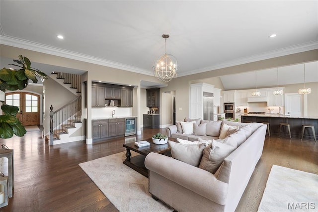 13750 Stonemont Ct, Town And Country, MO 63131 - living room featuring beverage cooler, a chandelier, crown molding, stairway, and dark wood-type flooring