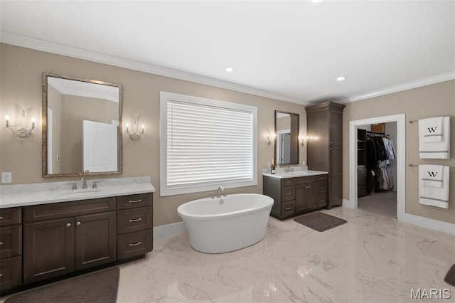 13750 Stonemont Ct, Town And Country, MO 63131 - full bath with two vanities, a freestanding bath, ornamental molding, baseboards, and recessed lighting