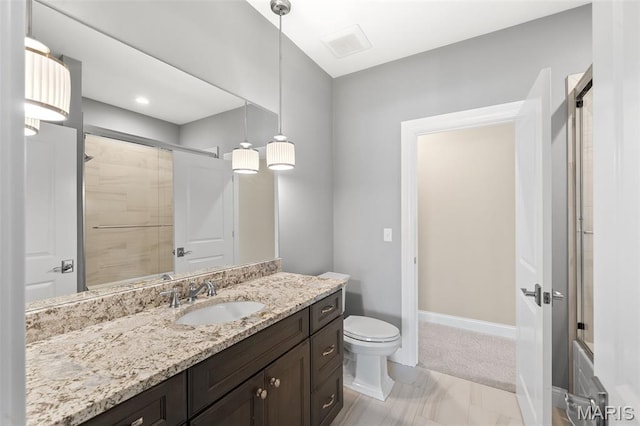 13750 Stonemont Ct, Town And Country, MO 63131 - bathroom with vanity, tiled shower, toilet, baseboards, and marble look tiles