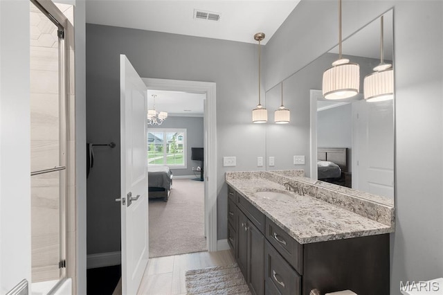 13750 Stonemont Ct, Town And Country, MO 63131 - ensuite bathroom featuring vanity, a stall shower, baseboards, and a chandelier