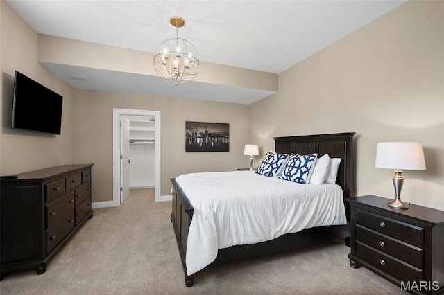 13750 Stonemont Ct, Town And Country, MO 63131 - bedroom featuring light carpet, baseboards, a chandelier, and a spacious closet