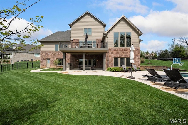 13750 Stonemont Ct, Town And Country, MO 63131 - back of house featuring a balcony, a patio area, and brick siding