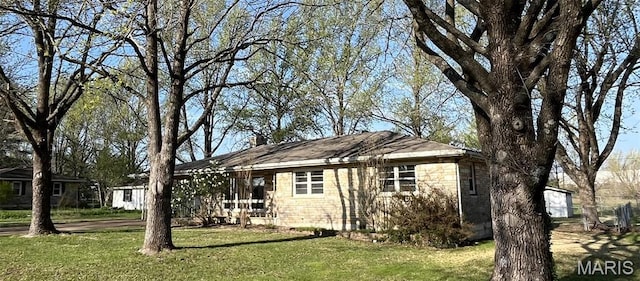 503 N Louise Ave, St James, MO 65559 - view of front of home with a front lawn and a chimney