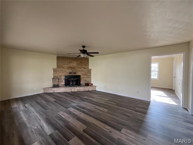 503 N Louise Ave, St James, MO 65559 - unfurnished living room featuring a ceiling fan, dark wood-style flooring, baseboards, and a fireplace