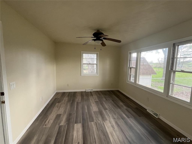 503 N Louise Ave, St James, MO 65559 - empty room with dark wood-style flooring, baseboards, and a ceiling fan