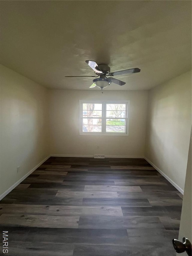 503 N Louise Ave, St James, MO 65559 - spare room with ceiling fan, baseboards, and dark wood-type flooring