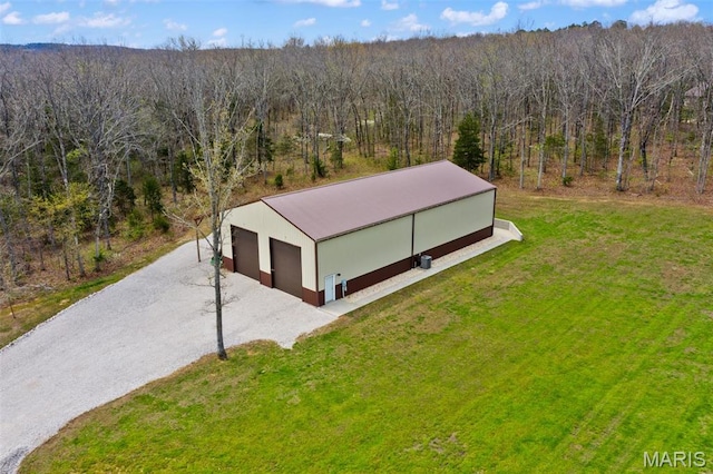view of subject property featuring a forest