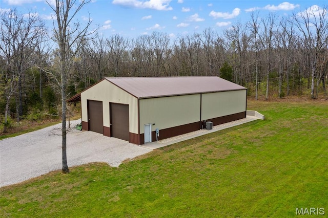 detached garage with a forest view