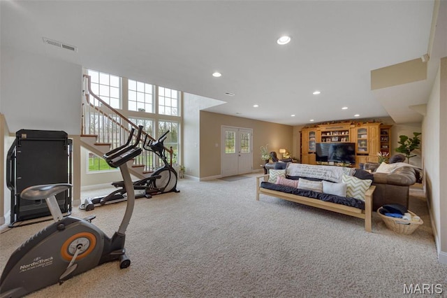 living area featuring baseboards, recessed lighting, carpet, and stairway