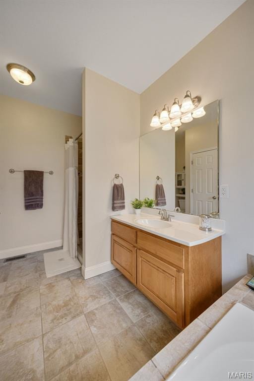 bathroom featuring vanity and curtained shower