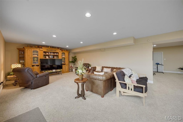 living area with light carpet, recessed lighting, and baseboards