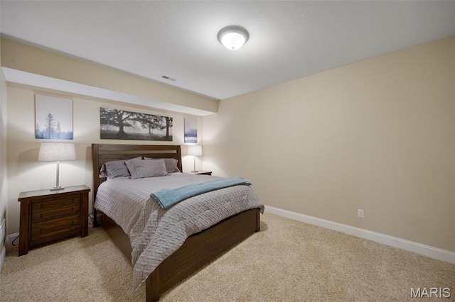 carpeted bedroom with baseboards