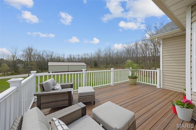 wooden deck featuring a yard