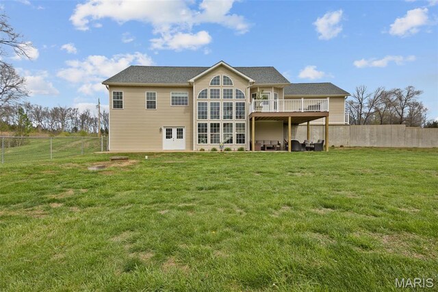 back of property featuring a wooden deck