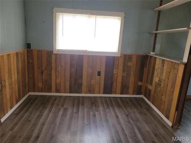 35 Marler Dr, Wappapello, MO 63966 - unfurnished room featuring wood walls and wood finished floors