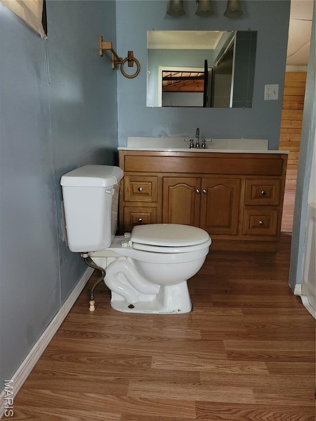 35 Marler Dr, Wappapello, MO 63966 - bathroom with toilet, wood finished floors, baseboards, and vanity