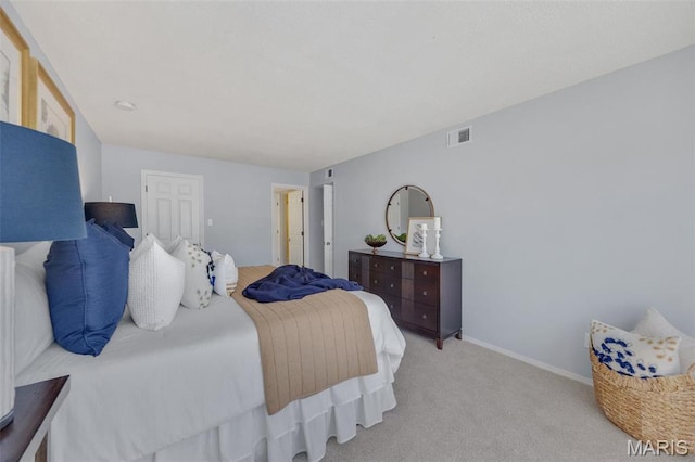 carpeted bedroom with baseboards