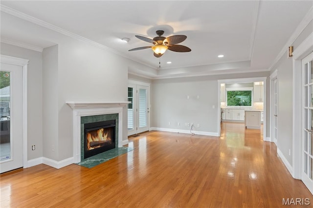 809 Star Ridge Ct, Defiance, MO 63341 - unfurnished living room with light wood-style floors, a high end fireplace, ceiling fan, recessed lighting, and crown molding