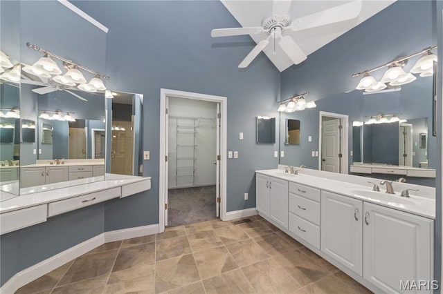 809 Star Ridge Ct, Defiance, MO 63341 - bathroom featuring double vanity, a ceiling fan, high vaulted ceiling, a walk in closet, and a chandelier