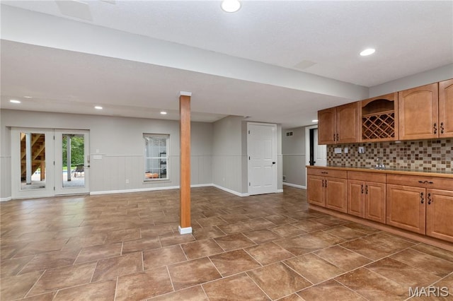 809 Star Ridge Ct, Defiance, MO 63341 - kitchen featuring open floor plan, recessed lighting, tasteful backsplash, and wainscoting