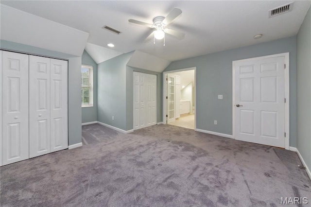 809 Star Ridge Ct, Defiance, MO 63341 - unfurnished bedroom featuring lofted ceiling, carpet floors, multiple closets, a ceiling fan, and ensuite bath