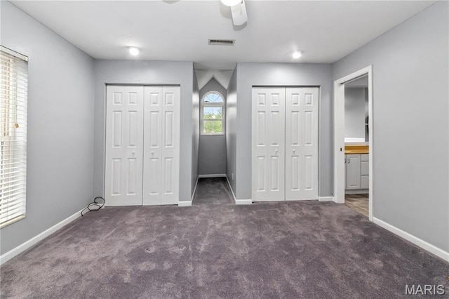 809 Star Ridge Ct, Defiance, MO 63341 - unfurnished bedroom featuring multiple closets, carpet flooring, connected bathroom, and a ceiling fan