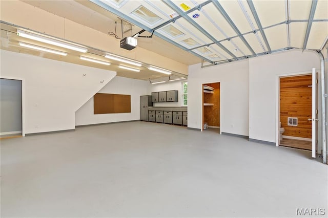809 Star Ridge Ct, Defiance, MO 63341 - garage featuring a garage door opener and baseboards